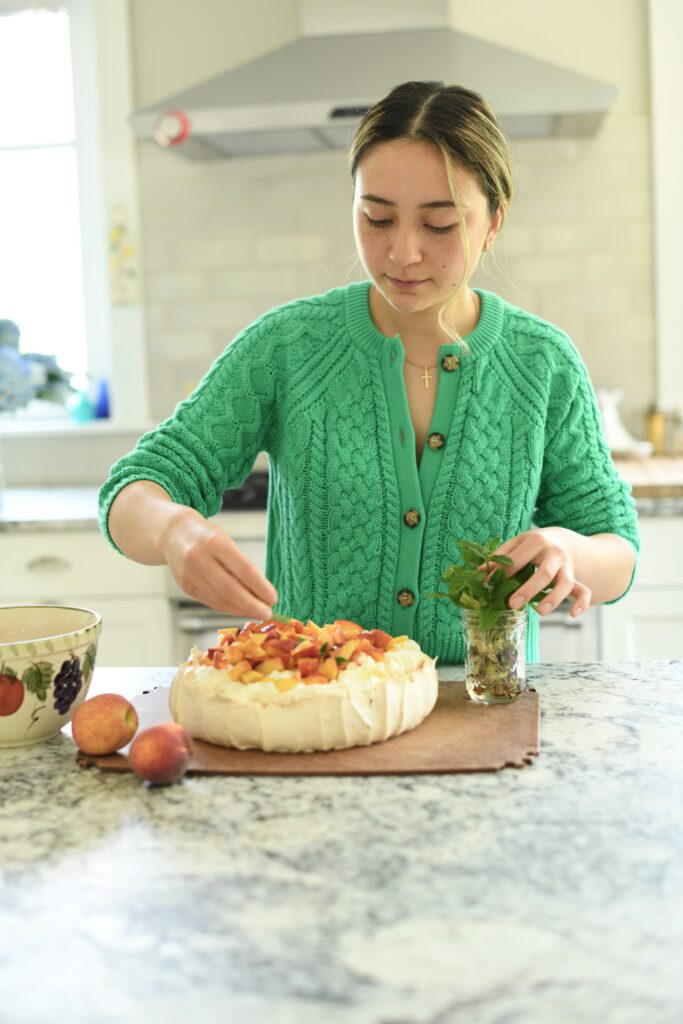 Amanda Palma decorating Pavlova